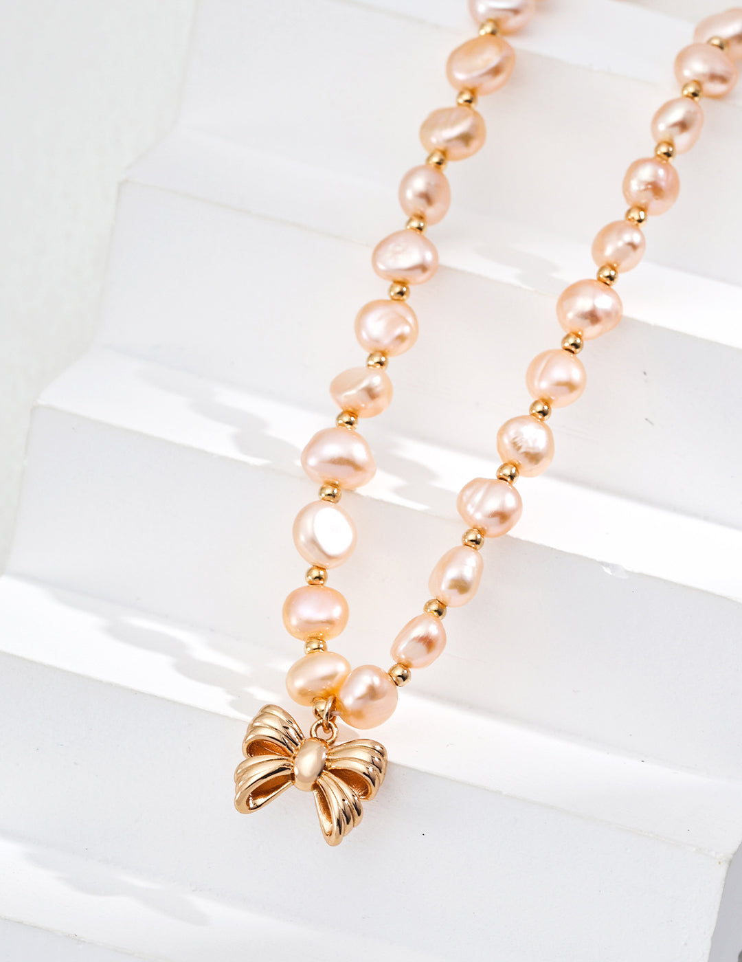 Vintage Gold-Tone Natural Pink Pearl Necklace with Bow Charm